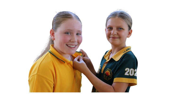 Student pinning badge on another student.