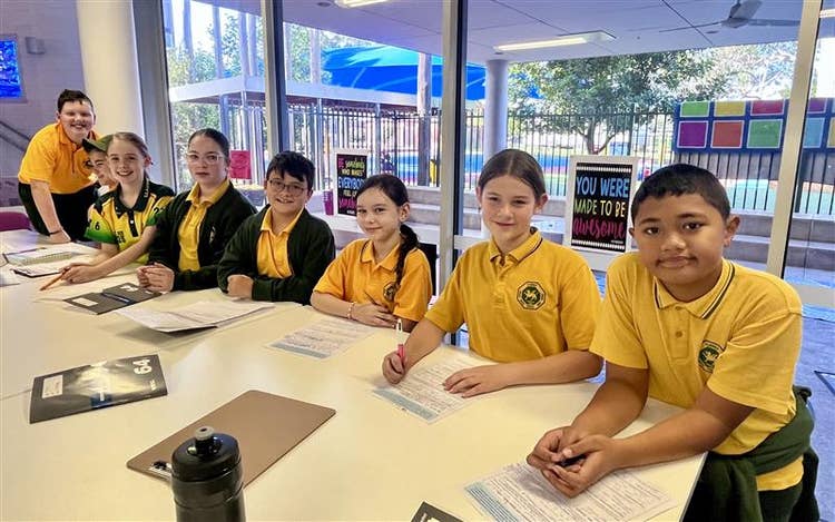 Students working together at a debating workshop.